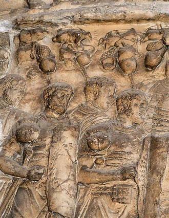 Roman relief, showing soldiers marching in battle dress and with packs tied to the ends of their spears.